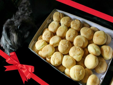 Jo's Aunt's cream puffs being inspected by my furry friend